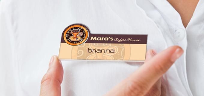 Custom employee name badges in engraved plastic, metallic, and full color styles