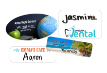 Specialty custom badges with unique shapes, finishes, and branding details