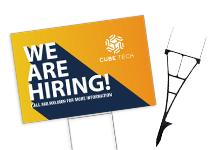 Custom full‑color yard sign with “We Are Hiring” message mounted on a metal wire stake, shown alongside the step stake used for outdoor display.